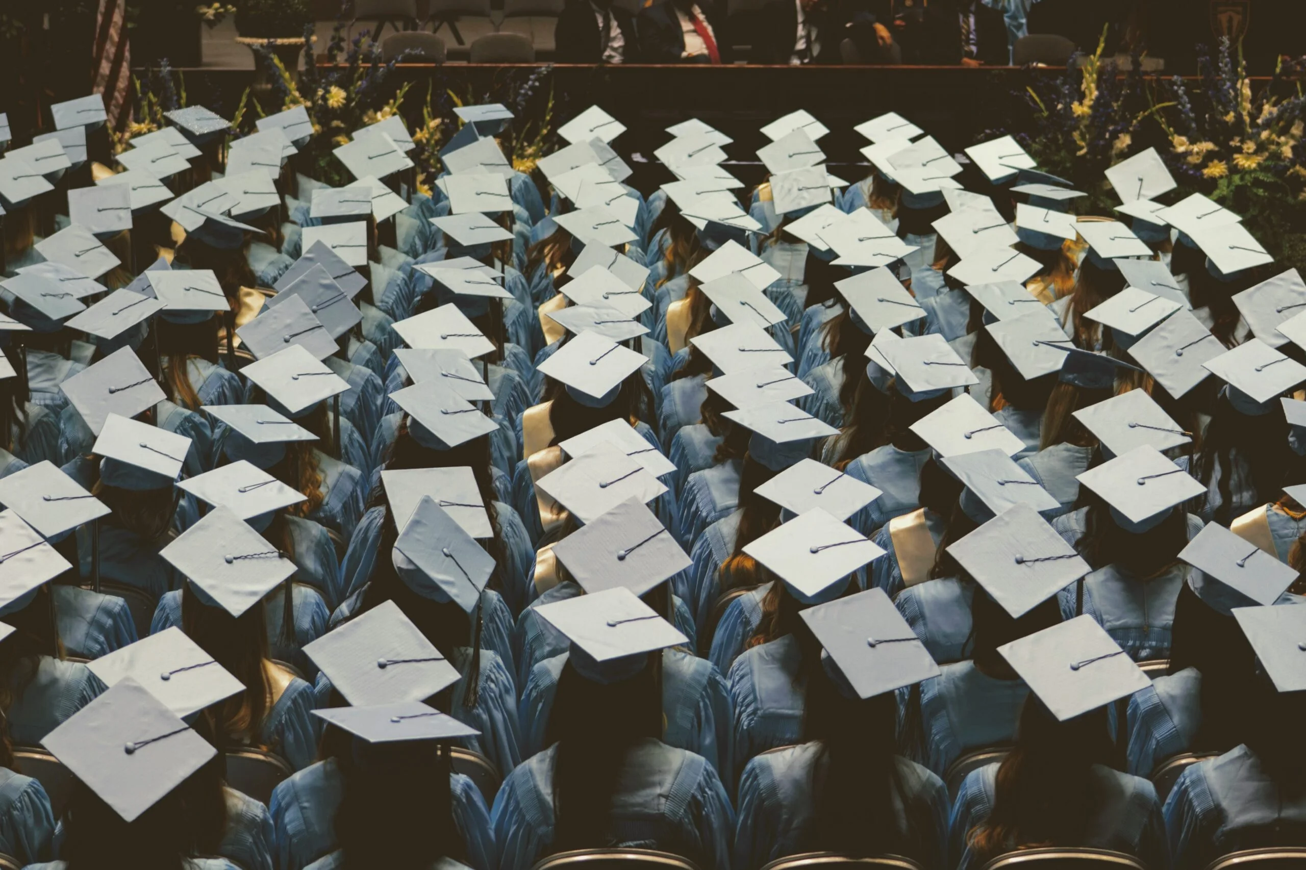 birdseye view of a crowd wearing graduation cap and gown
